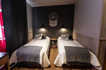 Фото номера Двухместный номер с 2 отдельными кроватями Отель Wilderness Hotel Kuusamo г. Kiviperä 7